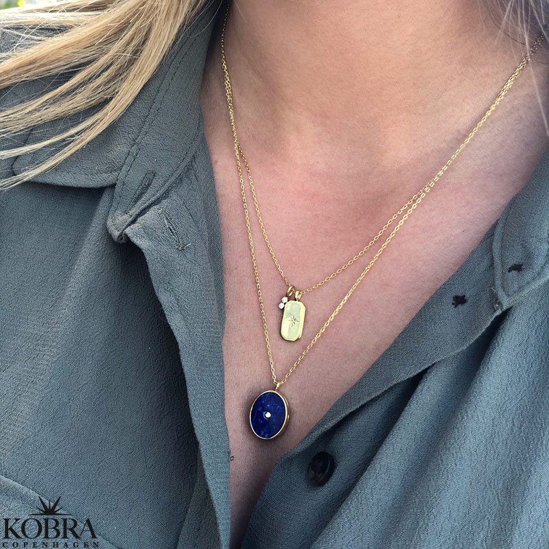 "Twinkle" guld halskde med stjerne og charm