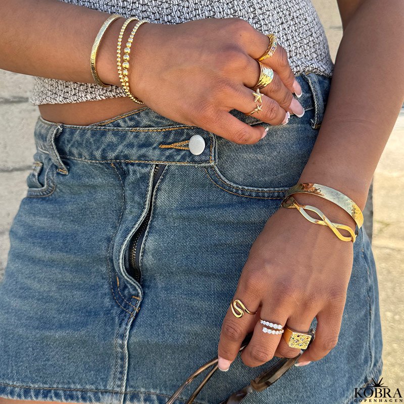 "Naia" blget ring i guld