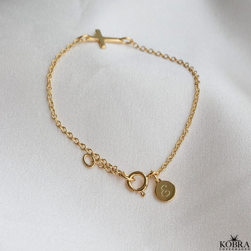 "Trust" 18 carat gold plated cross bracelet