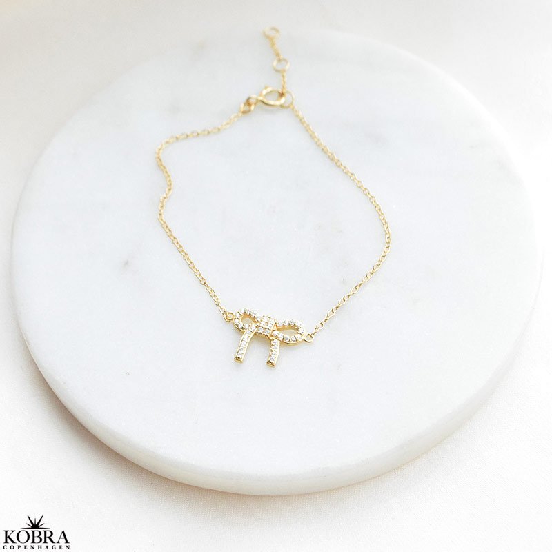 "Leonora" 18 carat gold-plated bow bracelet with white zirconia