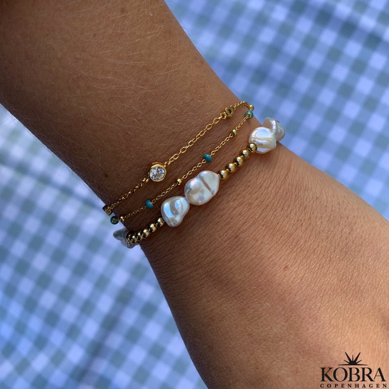 "Jenny" guld armbnd med hvide sten