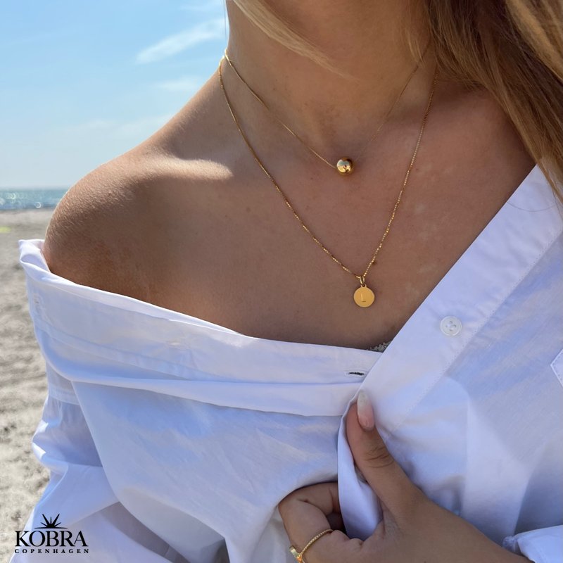 "Ghita" gold necklace with gold ball