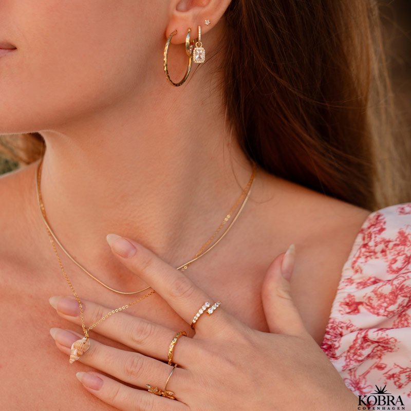 "Stardust" small star earrings in gold