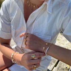 "Shiela" guld armcuff med muslinger