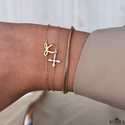 "Runa" gold cross bracelet with white zirconia stone