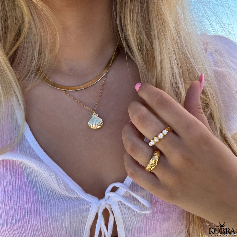  "Shiela" gold locket shaped like a clam