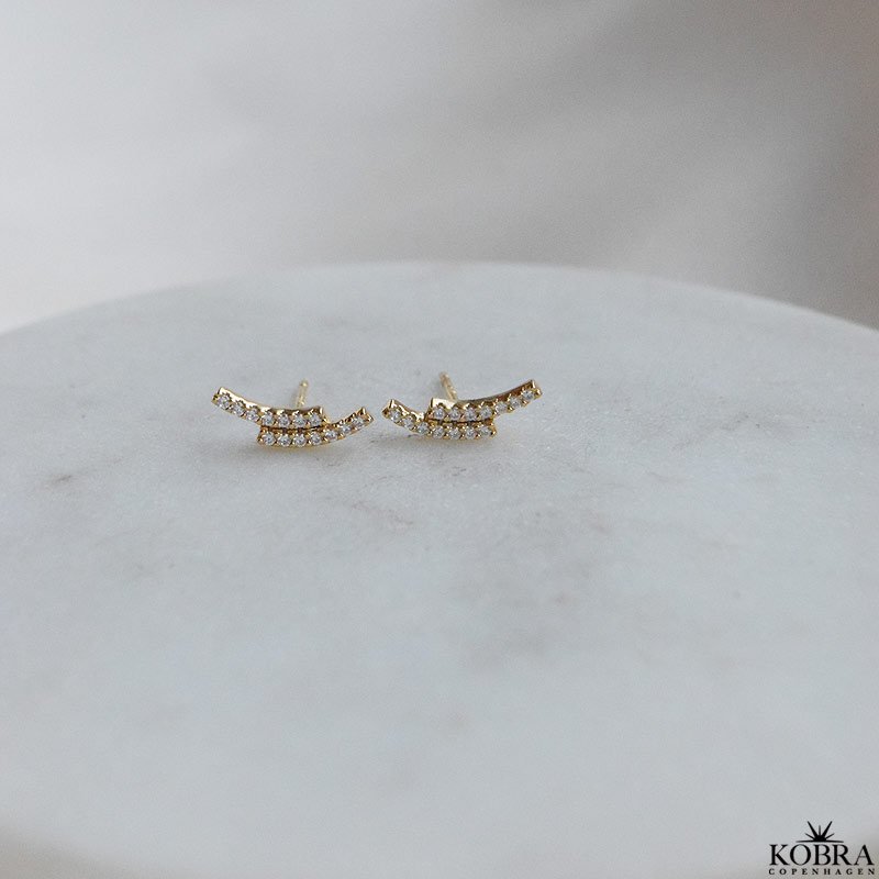 "Stormy" guld reringe med hvide zirkonia sten