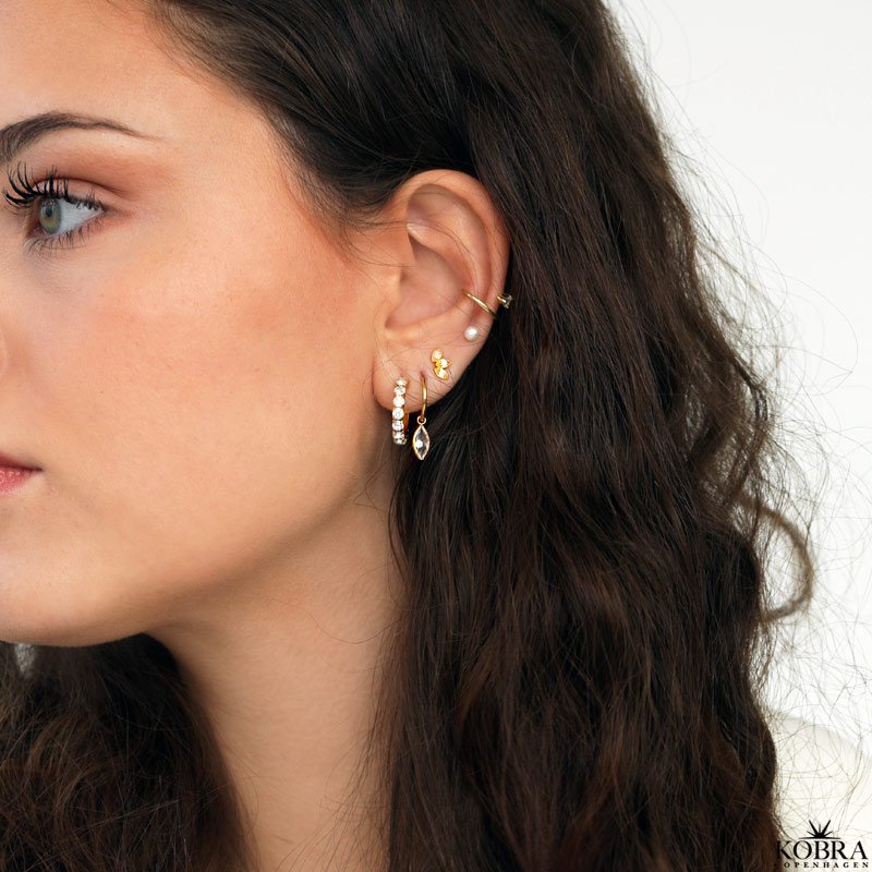 "Vegas" guld earcuff med drbeformet sten