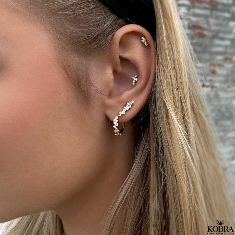 "Mikami" gold ear studs in a unique design