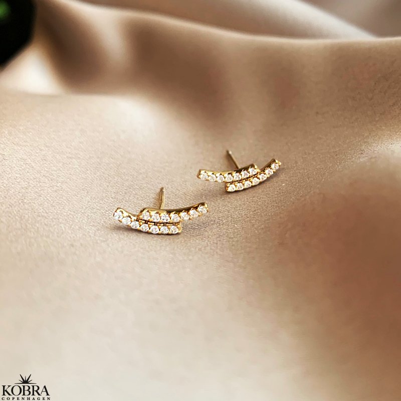 "Stormy" guld reringe med hvide zirkonia sten