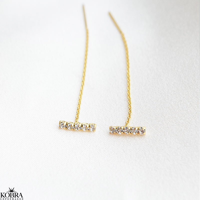 "Brilliant" guld retrde med hvide sten