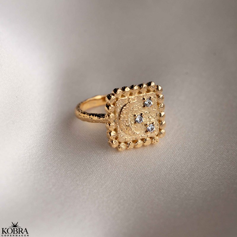 "Moondust" gold ring with moons and stars