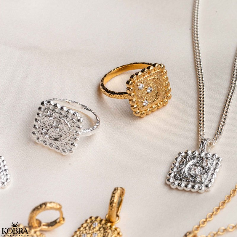 "Moondust" gold ring with moons and stars