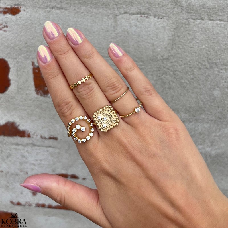 "Moondust" gold ring with moons and stars