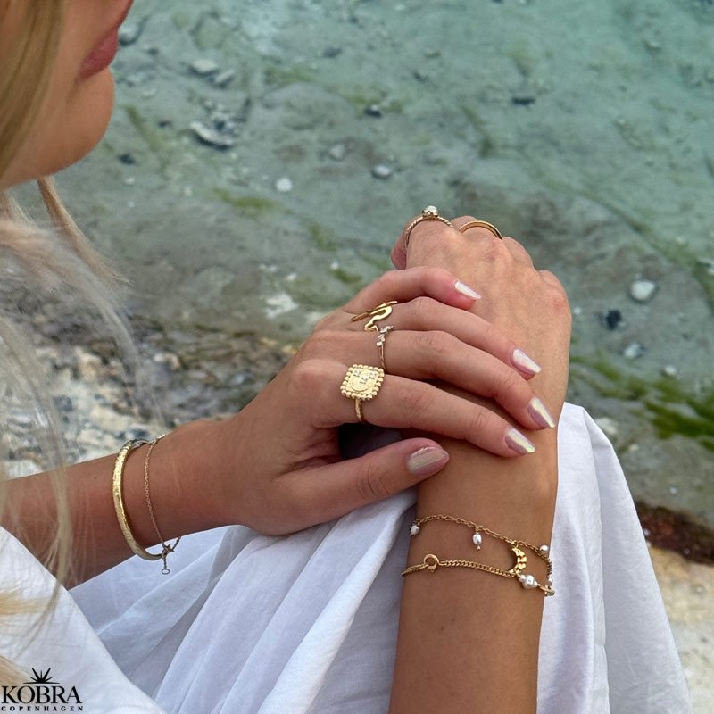 "Moondust" gold ring with moons and stars