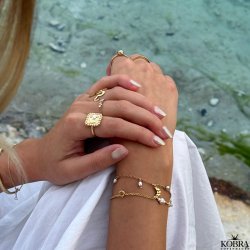 "Moondust" gold ring with moons and stars