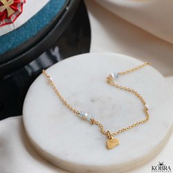 Studenter halskde i guld med hue-vedhng og bl akvamariner