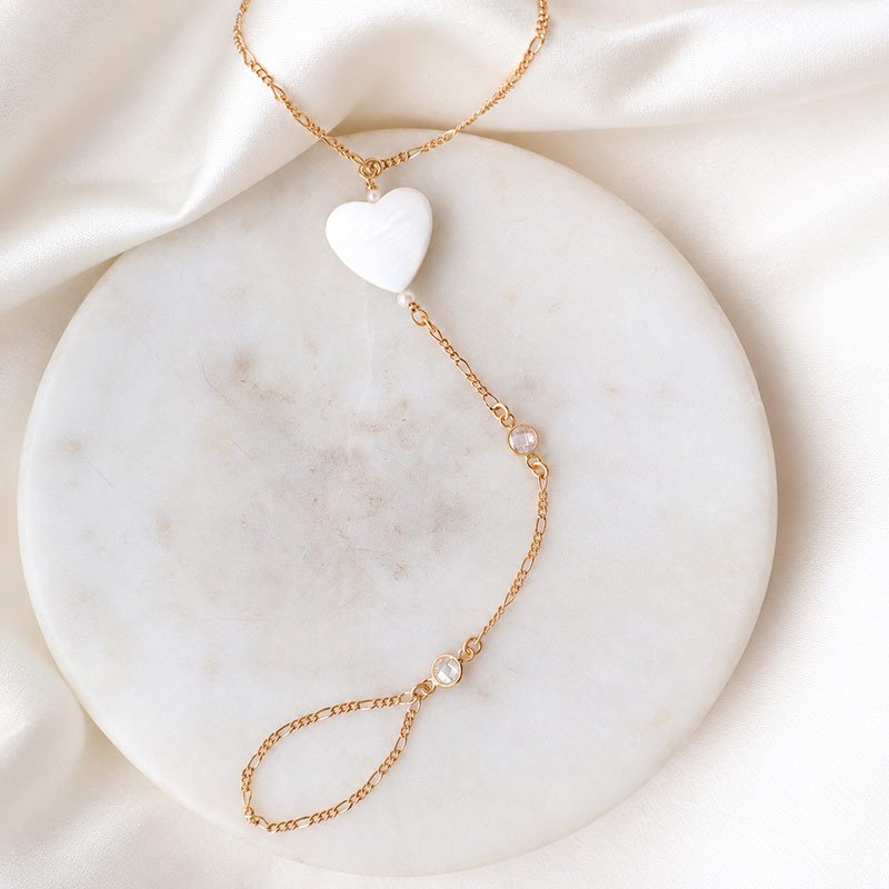 "Wild Heart" gold plated hand chain with mother of pearl