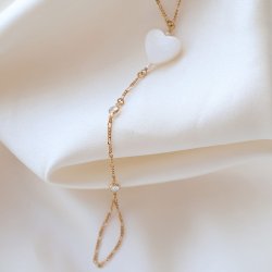 "Wild Heart" gold plated hand chain with mother of pearl