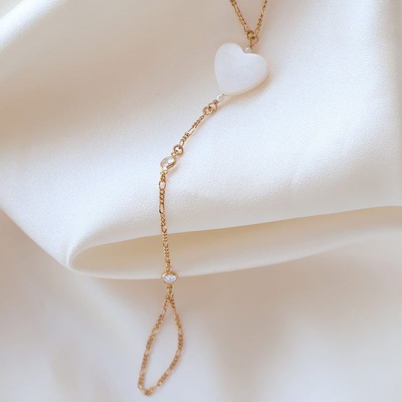 "Wild Heart" gold plated hand chain with mother of pearl