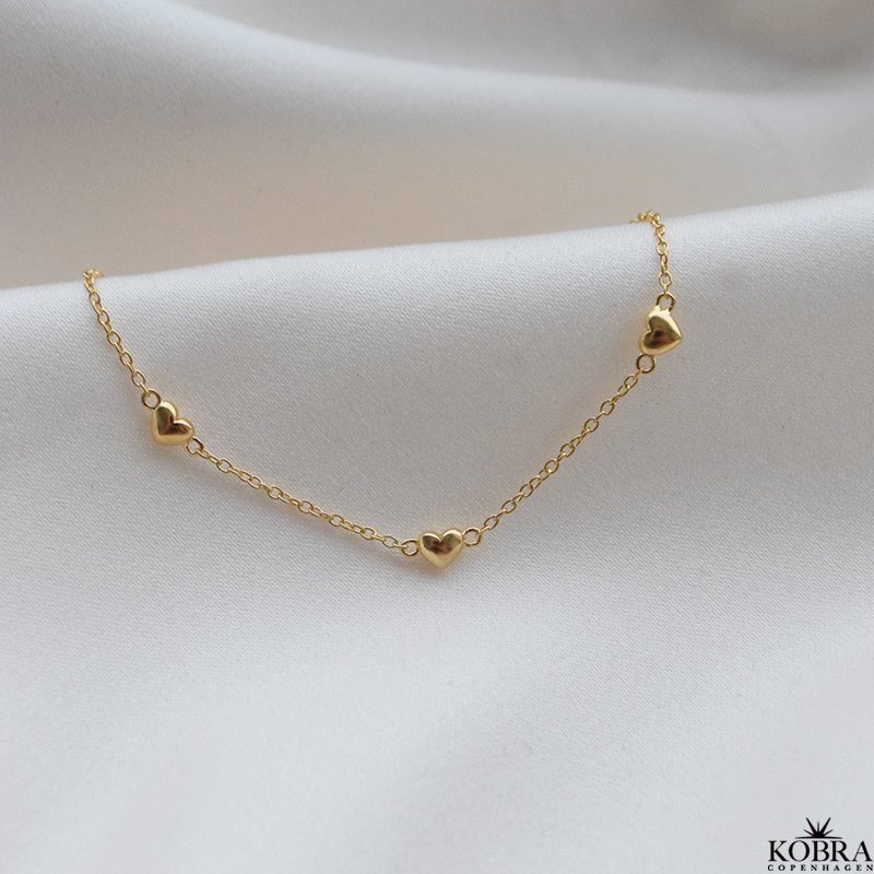 "Liva" guld armbnd med sm hjerter