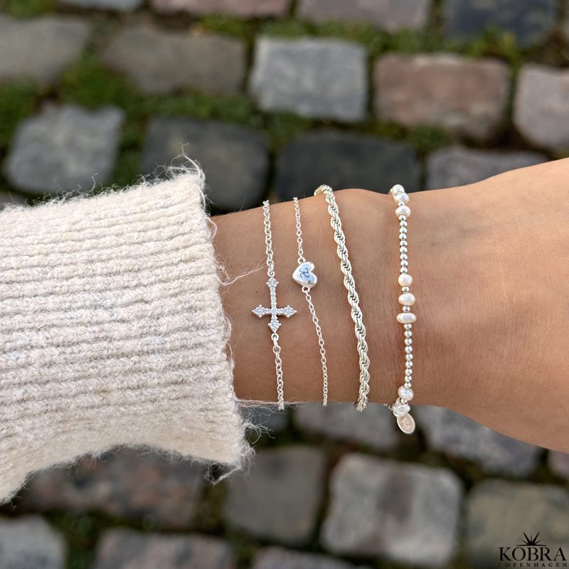 "Runa" silver cross bracelet with white zirconia stones