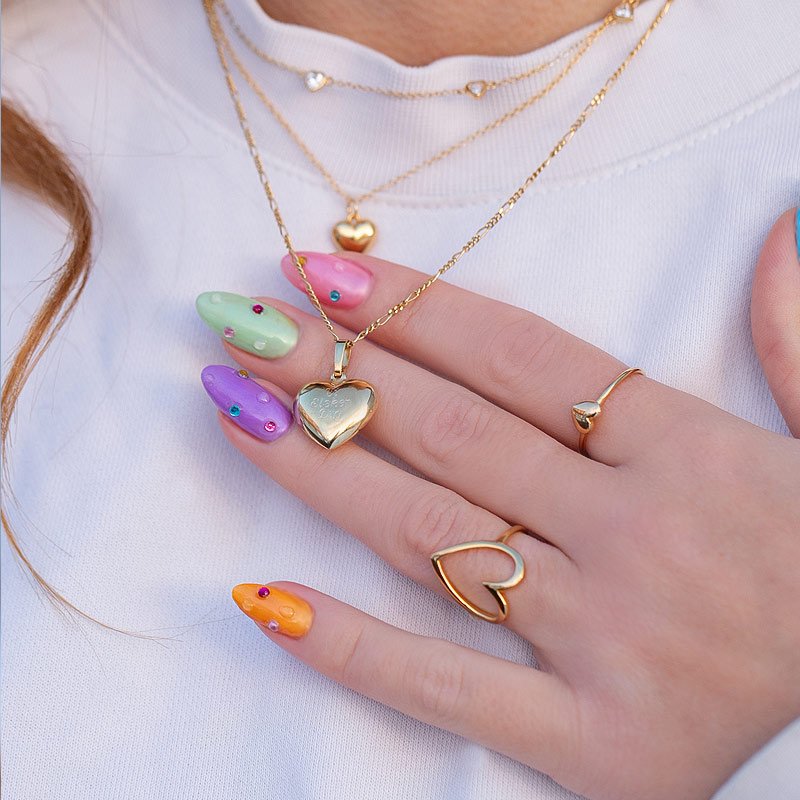 "Liva" enkel guld ring med lille hjerte