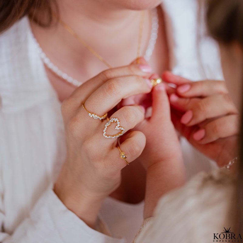 "Mikami" 18 carat gold plated ring with white stones