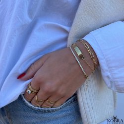 "Ivy" tennis armbnd i guld