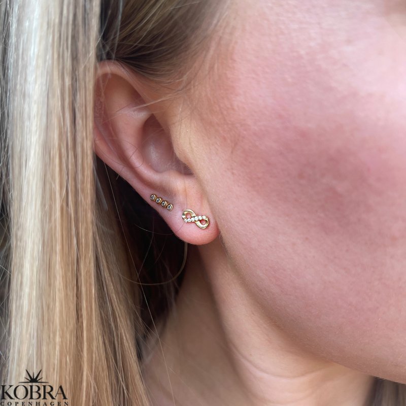 "Bound" Infinity earrings in gold with stones