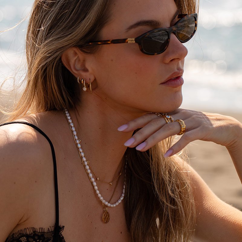 "Junie" heart hoops in gold with white stones