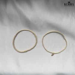 "Carly" Armbnd med tynd plade og sm guldkugler