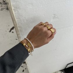 "Shiela" guld armcuff med muslinger