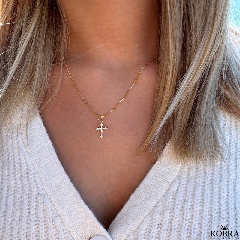 "Runa" gold cross necklace with white zirconia stones