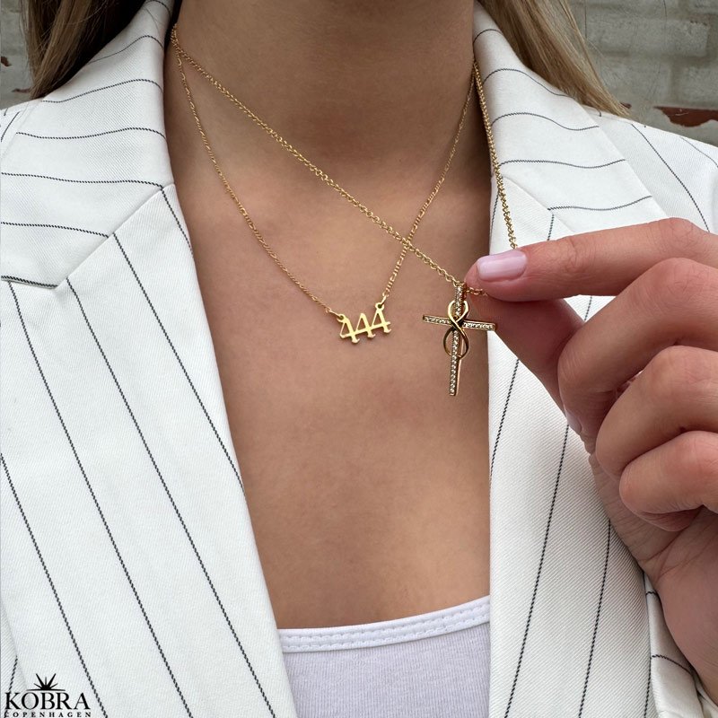 "Allana" cross necklace 18 karat gold plated with Infinity