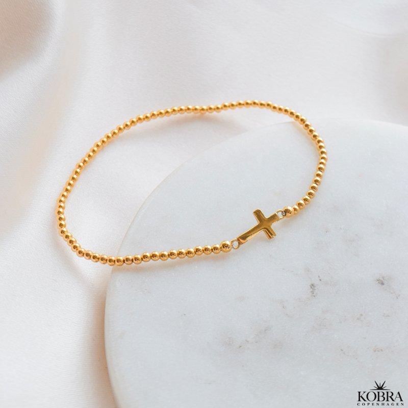 "Enna" gold cross bracelet with balls