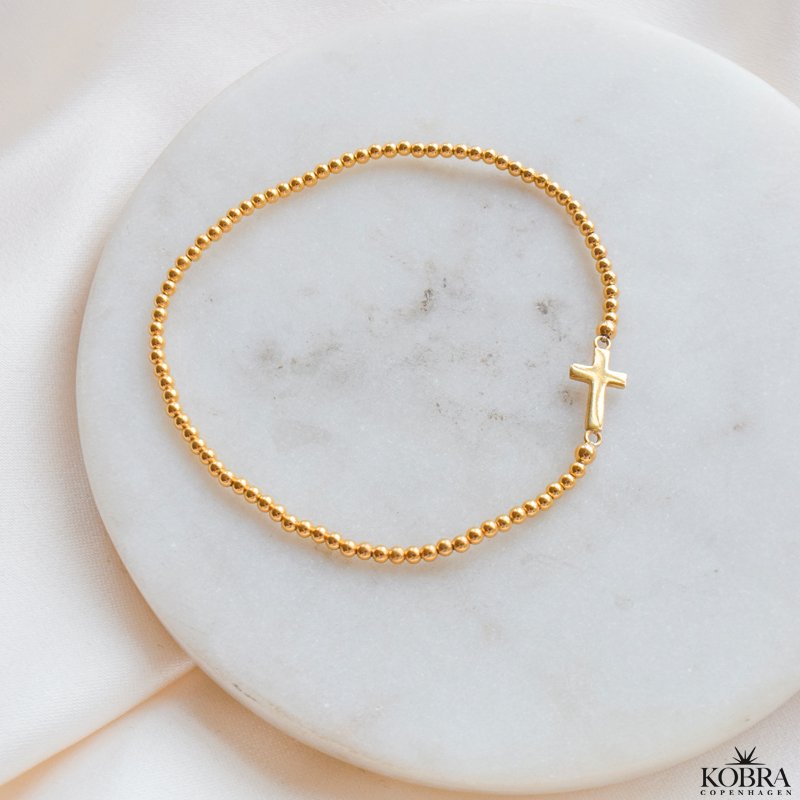 "Enna" gold cross bracelet with balls