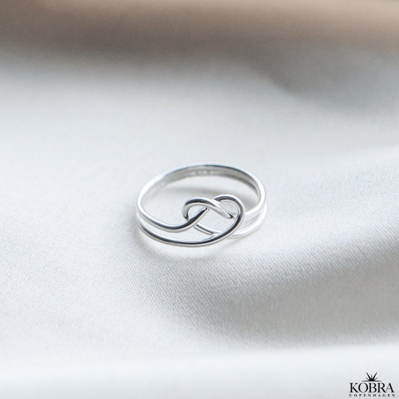 "Evermore" silver heart-shaped pretzel ring