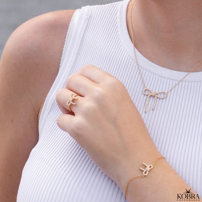 "Leonora" 18k gold plated bow necklace with stones