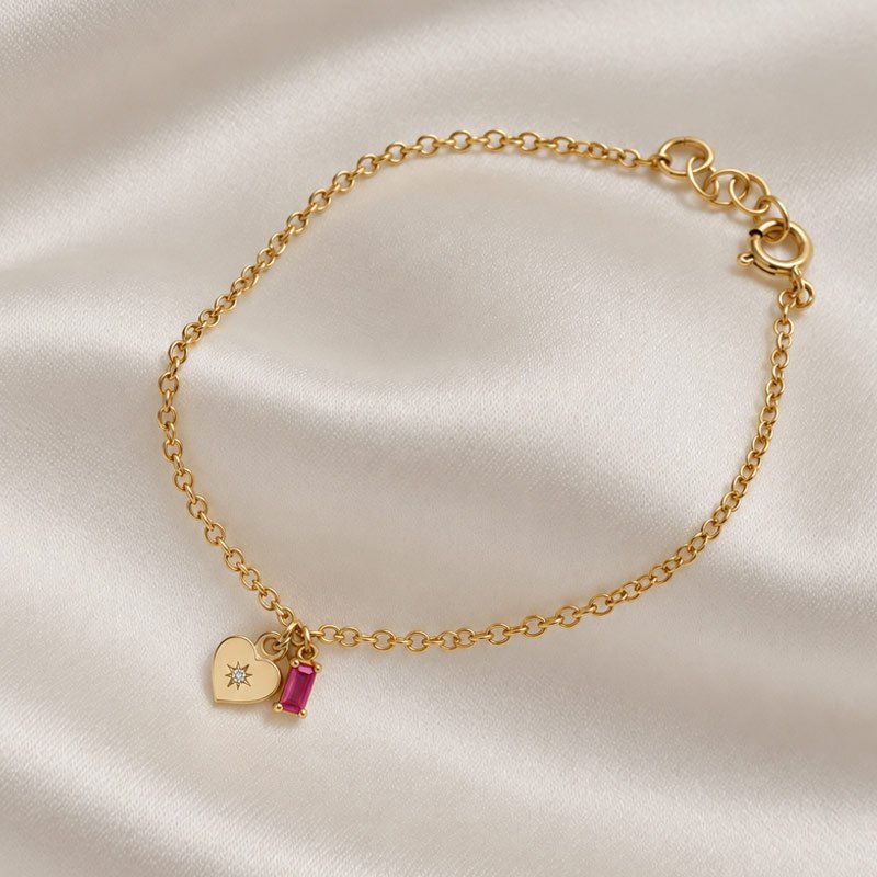 "Love Affair" 18k. forgyldt armb�nd med hjerte og pink sten