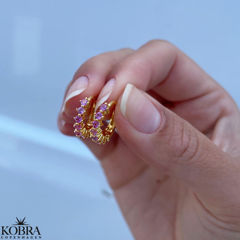 "Magnolia" guld reringe med farvet sten