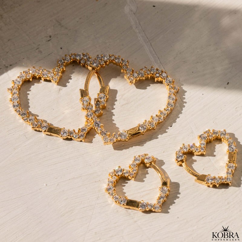 "Mikami" small gold heart earrings with white stones