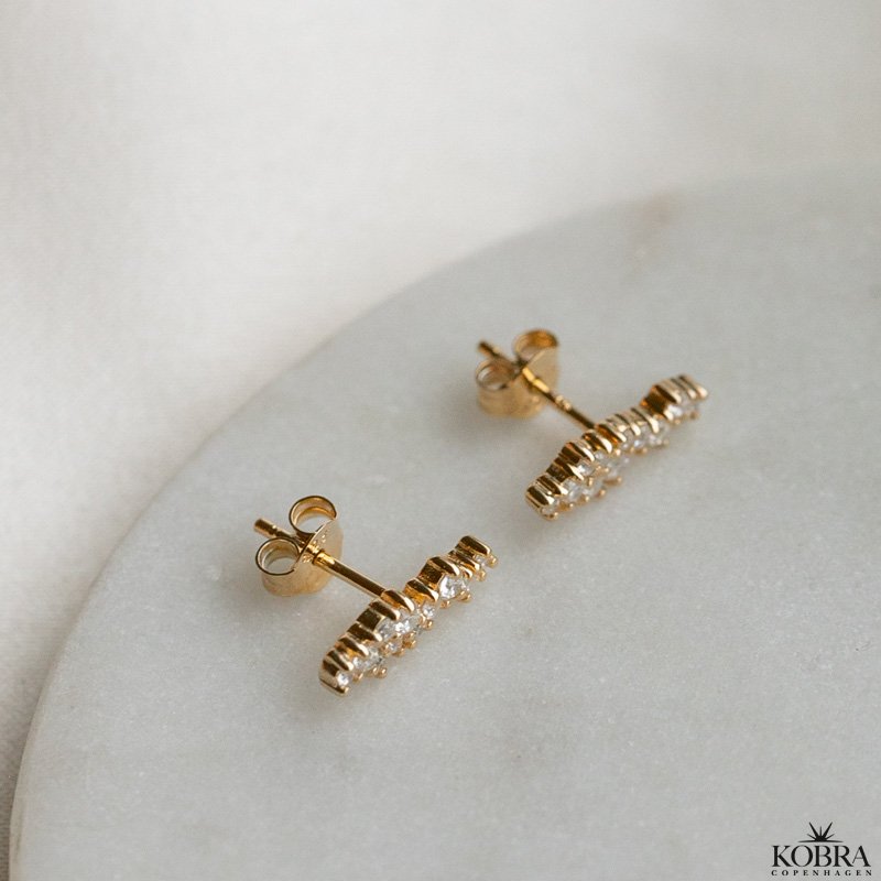 "Mikami" gold ear studs in a unique design