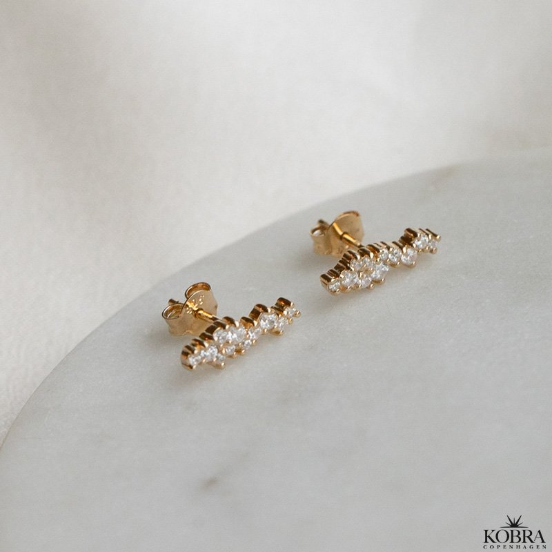 "Mikami" gold ear studs in a unique design