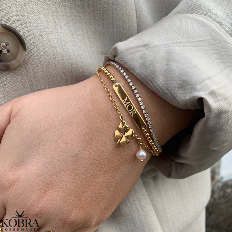 "Ivy" tennis armbnd i guld