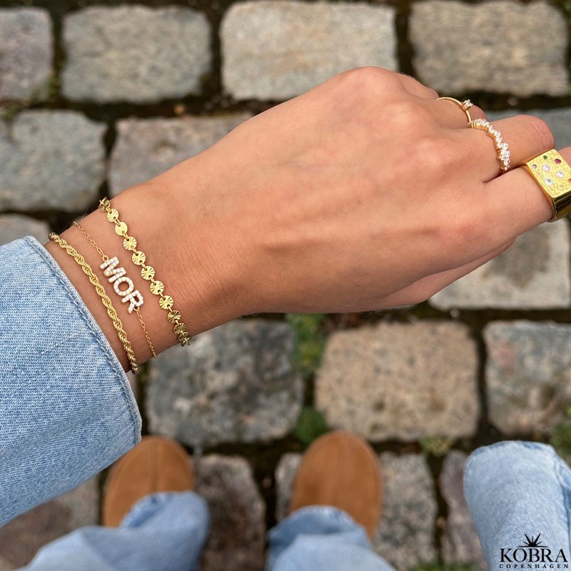 "SOL" guld armbnd med sm guld sole