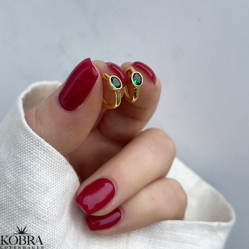 "Juniper" small gold-plated hoops with green stone