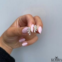 "Nia" guld reringe med hvide sten