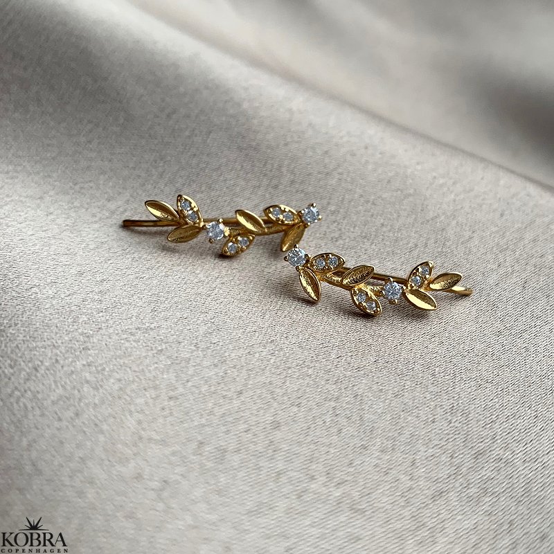 "Aia" gold leaf earrings with white stones