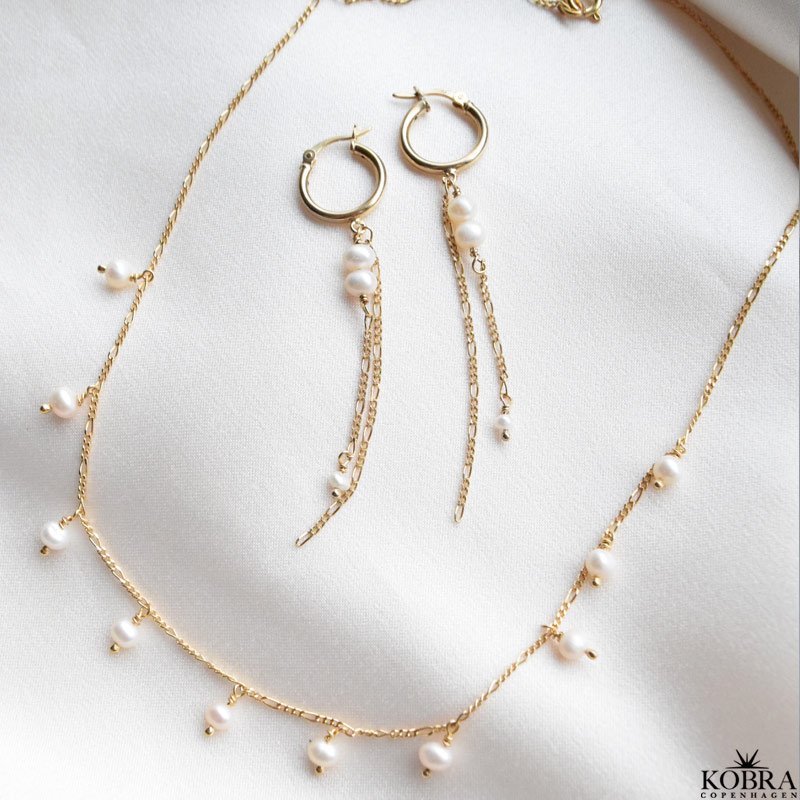 "Balance" gold earrings with white freshwater pearls